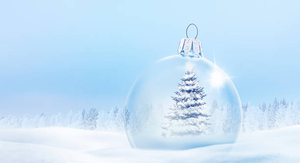 istock Glassy Christmas ball in a snow landscape 2241809714