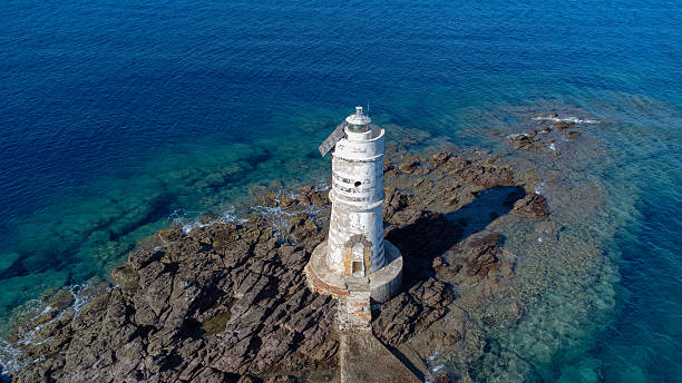 istock Mangiabarche Lighthouse above Crystal Clear Waters in Sardinia 2241815977