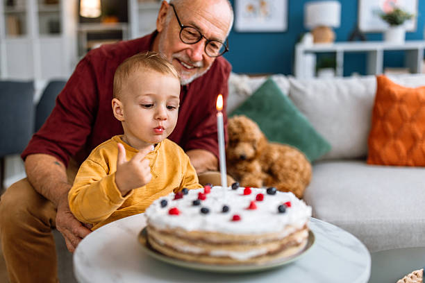istock Tasting birthday cake for Grandfather's Birthday 2241819180