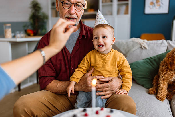 istock Birthday boy tasting birthday cake. 2241819342