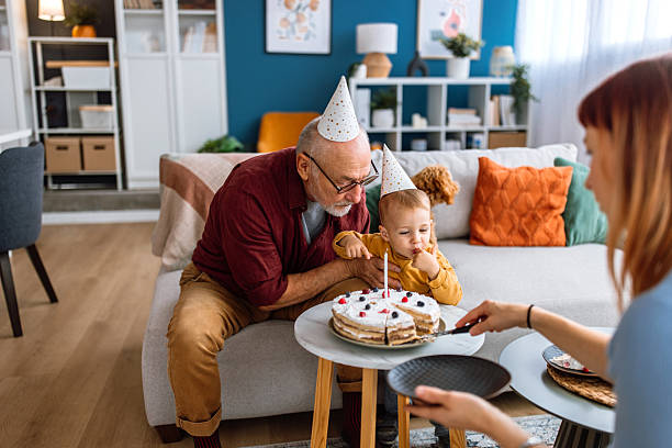 istock Family birthday celebration. Ready for birthday cake. 2241819365