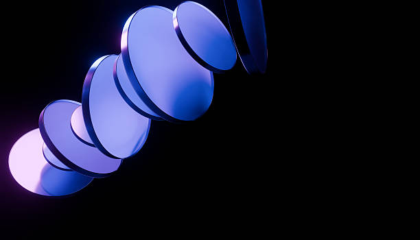 istock Abstract image of stacked, reflective blue discs against black background, creating futuristic and dynamic visual effect 2241820168
