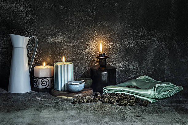 istock A still life with a green satin cloth next to several lit candles 2241822557
