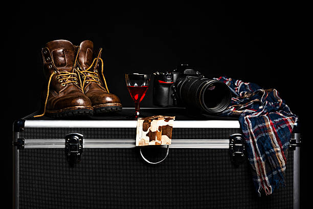 Close-Up Of Guitar And Clothes On Luggage