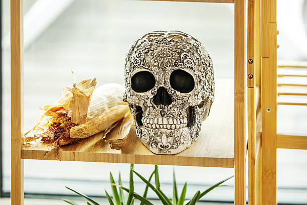 Decorative mexican style death skull on a bamboo wood shelf