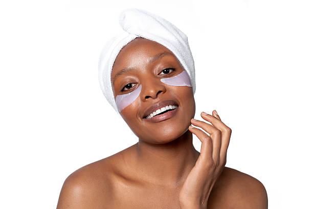 istock Woman enjoying self-care routine with under-eye masks in a bright setting 2241829089