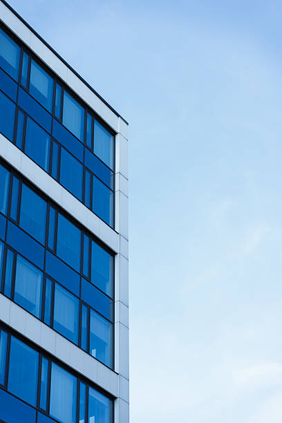 istock Modern Glass Office Building Against Sky 2241830049