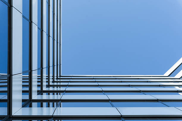 istock Modern Glass Building Against Clear Blue Sky 2241830120