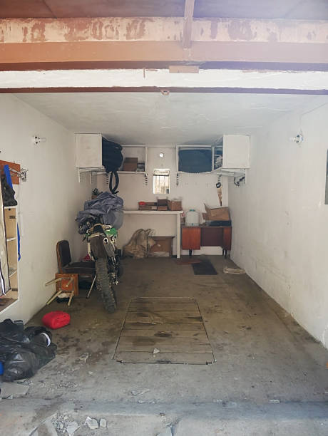istock Cluttered Garage Interior with Motorcycle and Storage 2241836544