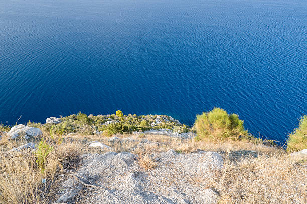 This landscape photo was taken in Europe, Greece, Peloponnese, Argolis, in summer. It shows the coast of Argolis (Peloponnese), under the Sun.