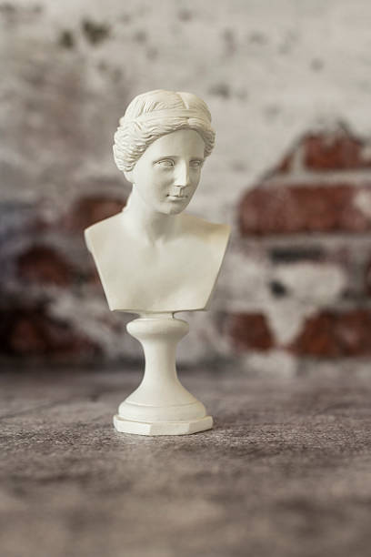 istock Small bust of a classical Greek figure on a gray background 2241849009