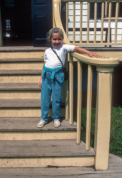 istock Fort William Historical Park - Girl Posing on Steps - 1988 2241853327