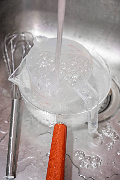 istock washing kitchen utensils in a stainless steel sink 2241856808