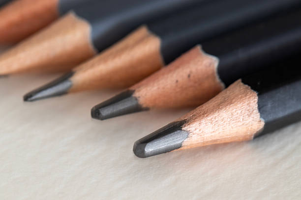 istock Pencils on white paper, pencil tip, macro, close-up, educational and art materials 2241858041