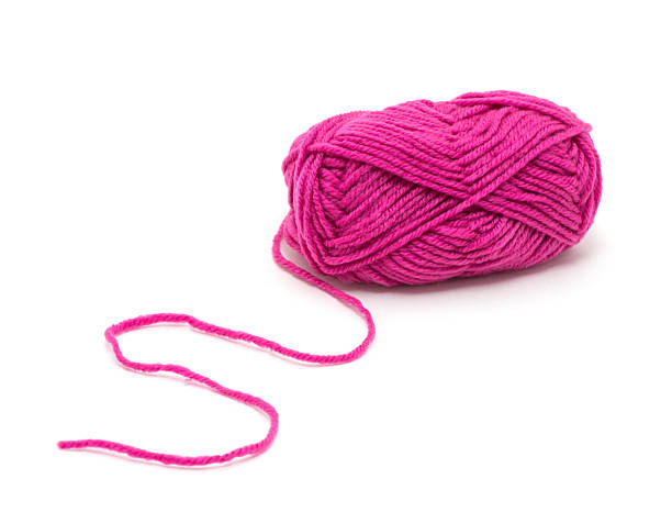 istock Pink knitting yarn isolated on white 2241860007