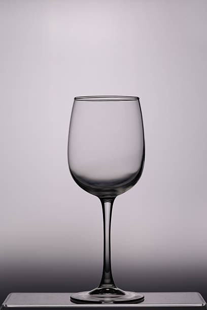 istock Tall wine glass, empty, photographed against the light 2241869654