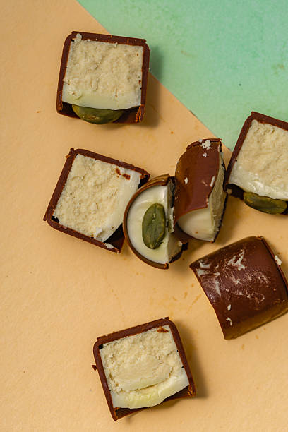 istock Sweets scattered on the table - chocolate with cream and nuts 2241869809