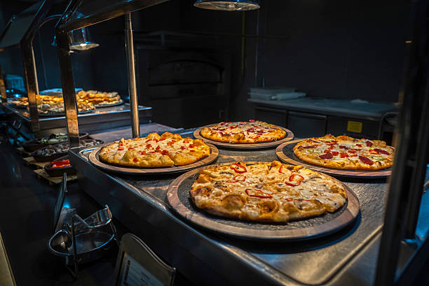 istock Fresh-baked pizzas on a pizzeria restaurant counter. 2241869829