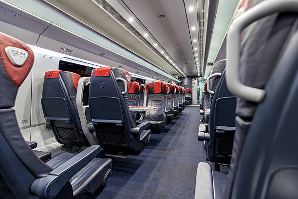istock Interior of a modern passenger train carriage. Perspective view. Nobody. 2241874889