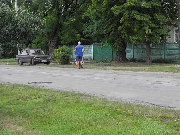 Man working with wheelbarrow in Grod village posluk z objects visible human dorga