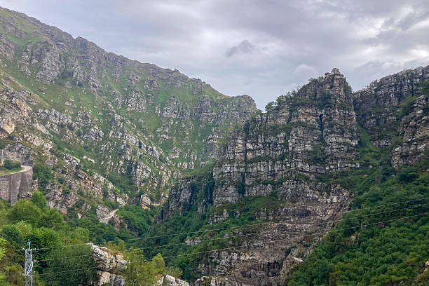 istock A dam surrounded by mountains and green highlands 2241880157