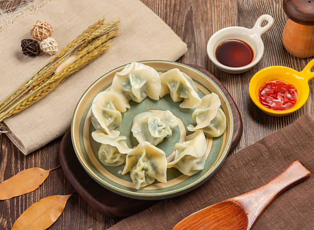 istock Asian tradition with these delectable Steamed Chive and pork dumplings. Perfect for showcasing authentic flavors and culinary art, ideal for food blogs and restaurant promotions. 2241880440