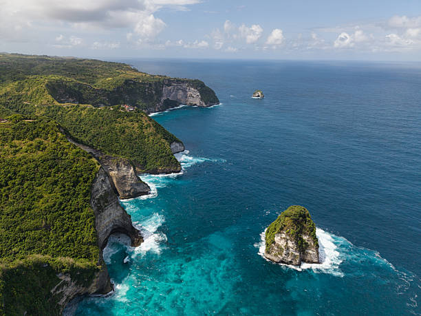 istock tranquil lagoon near limestone islet, idyllic turquoise lagoon surrounded by reef and sunlit sands Nusa Penida 2241899556