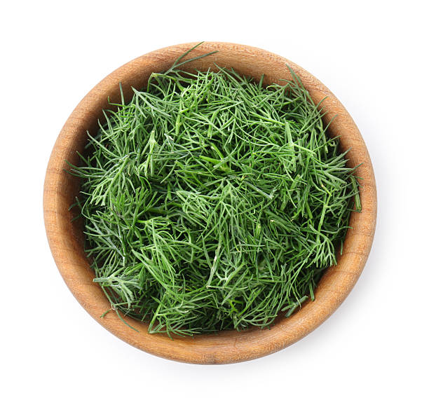 istock Fresh cut dill in bowl isolated on white, top view 2241900219