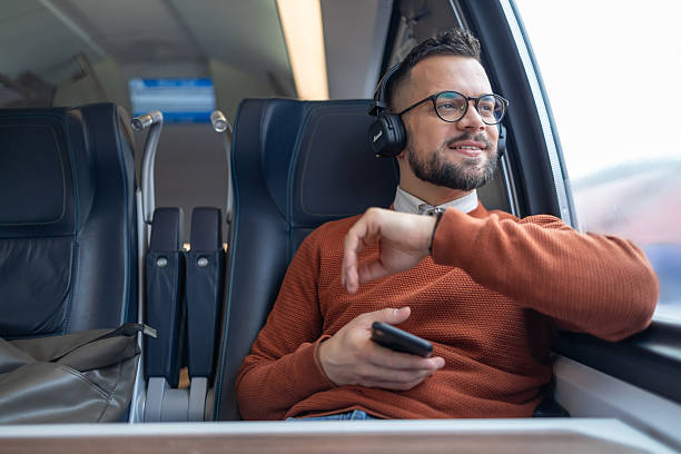 istock A young man is listening to music while traveling 2241900406