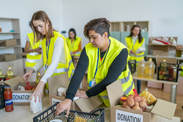 istock Volunteers preparing food donations for people in need 2241900427