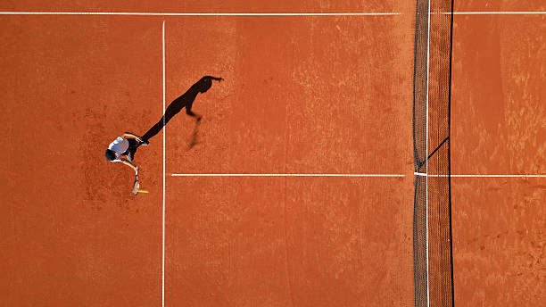 istock Tennis Player Mid-swing on Clay Court 2241900662