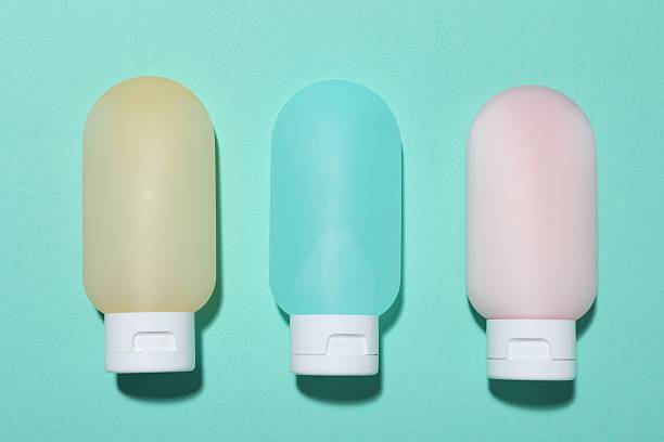 istock Cosmetic products on turquoise background, flat lay. Mockup for design 2241901728