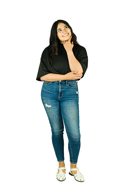 istock Cute woman thinking, smiling with ideas above 2241903438