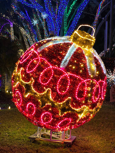 istock Giant Red Christmas Ornament Decoration Illuminated at Night 2241907533