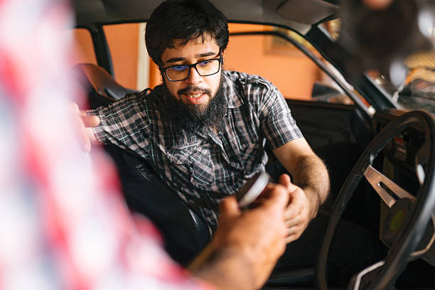 Authentic moment of classic car owner inside vehicle