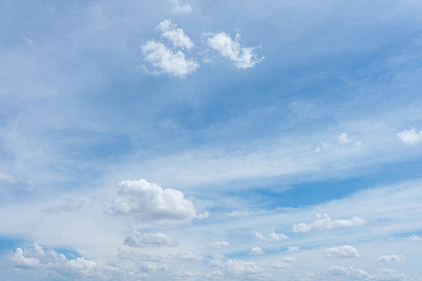 istock Bright blue sky featuring scattered white cumulus and wispy cirrus clouds in layers 2241917417