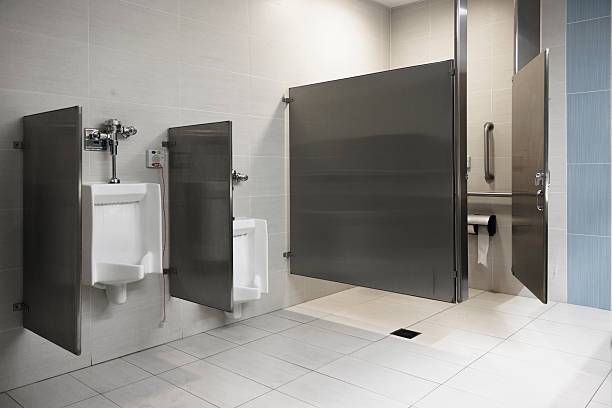 istock Public restroom with accessible emergency call system. Modern facility with privacy partitions and stainless steel fixtures. 2241925274