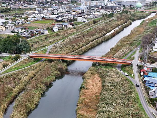 istock A bridge spans a river with a city in the background 2241928770