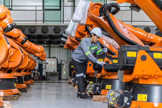 istock Engineer woman working in machine factory. Indian female engineer work in robot arm assembly plant 2241934138