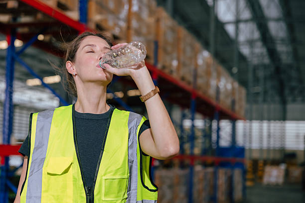 istock worker drinking water refresh dehydrate drink cool water chill relax brake in warehouse workplace 2241934208
