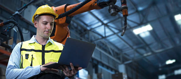 istock professional engineer, robotic technician work in modern factory industrial robot welding arm advance machine wide banner concept 2241934222