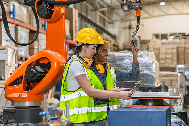 istock robotic engineer training, technician work in factory industry robot welding arm machine control 2241934223