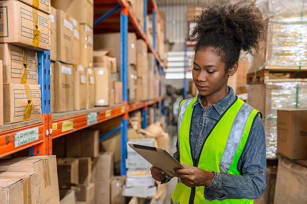 istock African black young smart worker working in cargo warehouse inventory employee staff with tablet 2241934239