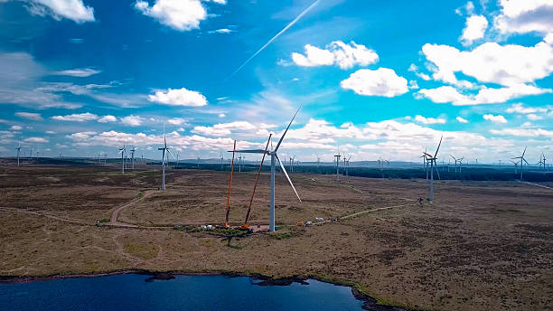 istock Construction and assembly of wind generators in fields with meadows and lakes 2241939665