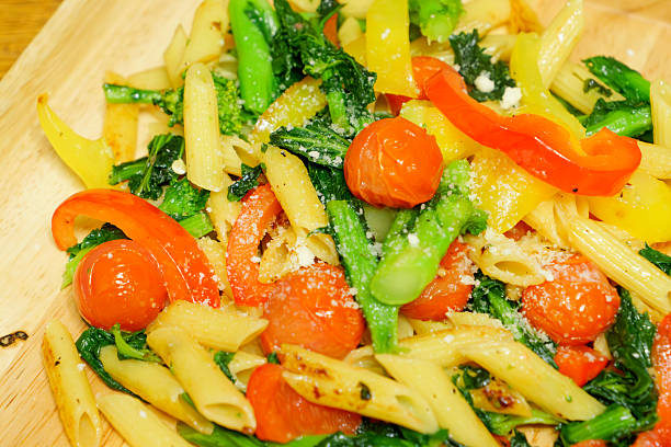 Close up of raw pasta on a blue background.