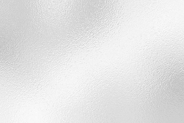 istock Gray or silver foil frosted glass effect texture background. Abstract gradient bright light reflection and shiny rough texture surface 2241942248