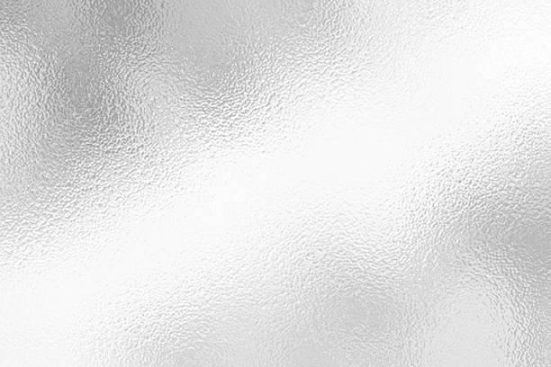 istock Gray or silver foil frosted glass effect texture background. Abstract gradient bright light reflection and shiny rough texture surface 2241942910