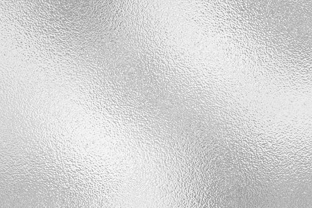 istock Gray or silver foil frosted glass effect texture background. Abstract gradient bright light reflection and shiny rough texture surface 2241942916