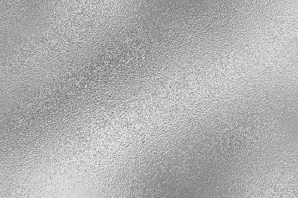 istock Gray or silver foil frosted glass effect texture background. Abstract gradient bright light reflection and shiny rough texture surface 2241942925