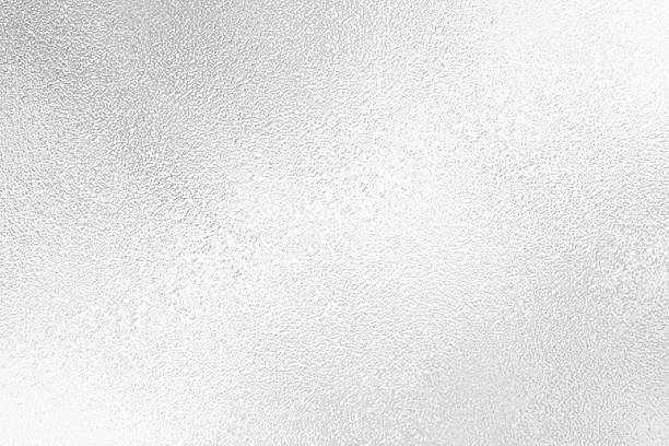 istock Gray or silver foil frosted glass effect texture background. Abstract gradient bright light reflection and shiny rough texture surface 2241942926